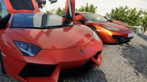 A photo shows two luxurious cars.