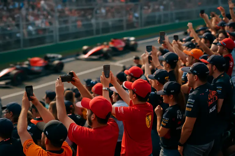 Fans watching GT cars during a paddock access period